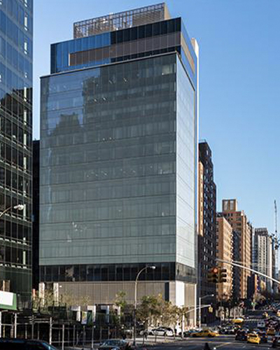 Exterior of the Josie Robertson Surgery Center, a modern glass building in NYC, now home to the Lavine Family Lounge after a 2021 pledge.