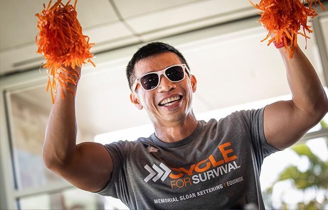 Male participant with pom poms