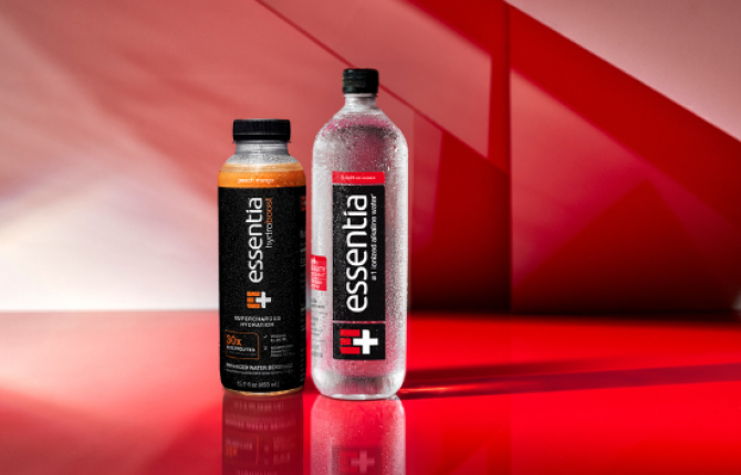 Essentia water bottles against a red background.