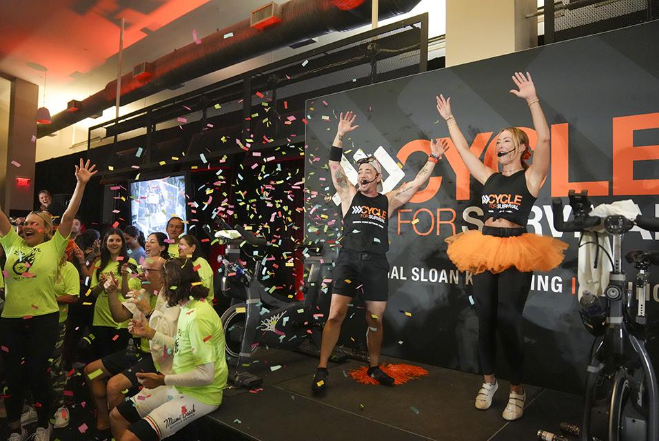 Cycling instructors cheering at a Cycle for Survival rare cancer fundraising event in Miami.  
