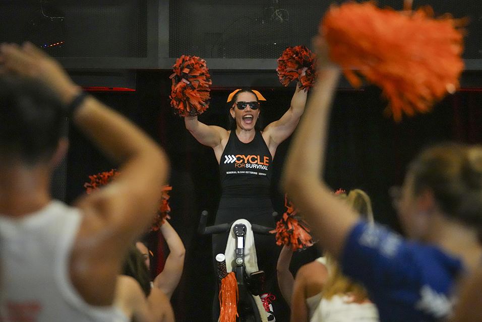 Cycling instructor leading a Cycle for Survival rare cancer fundraising ride in Miami.  