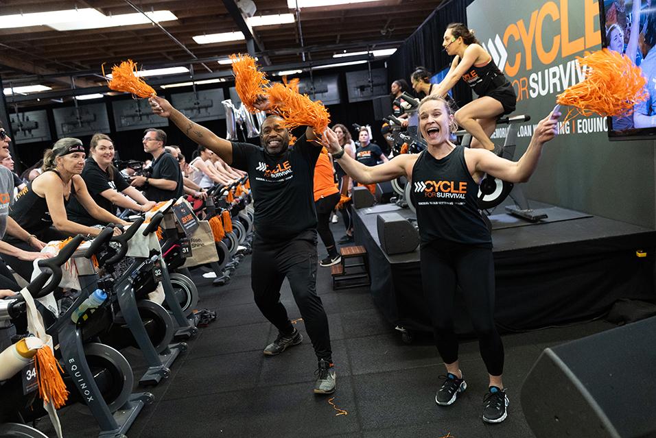 People dancing at a Cycle for Survival rare cancer fundraising event in Palo Alto.  